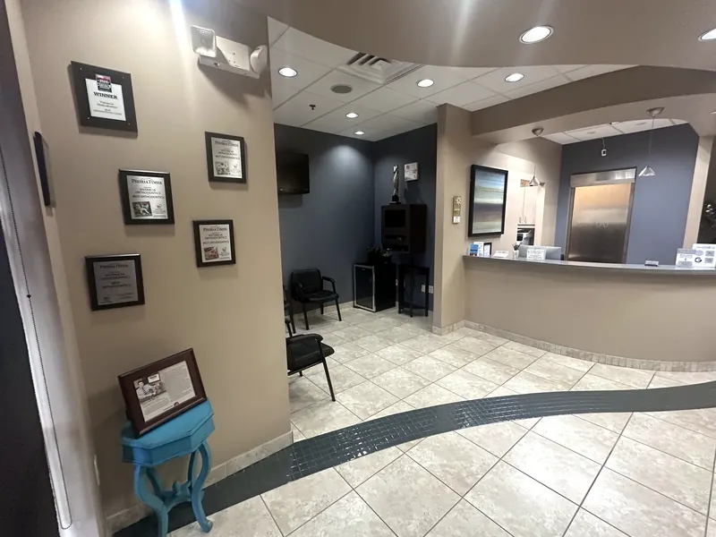 Wall of Peoria Times Best Orthodontics award plaques in the office