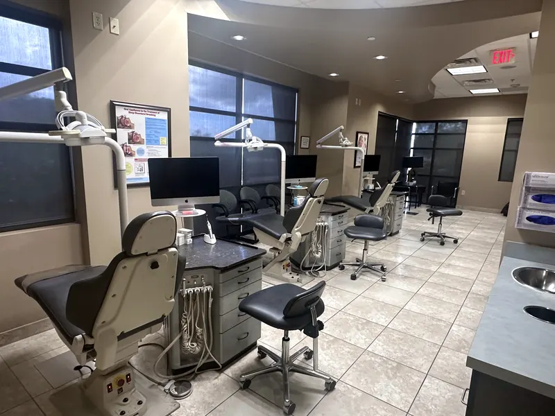 Open treatment area with patient chairs by the windows